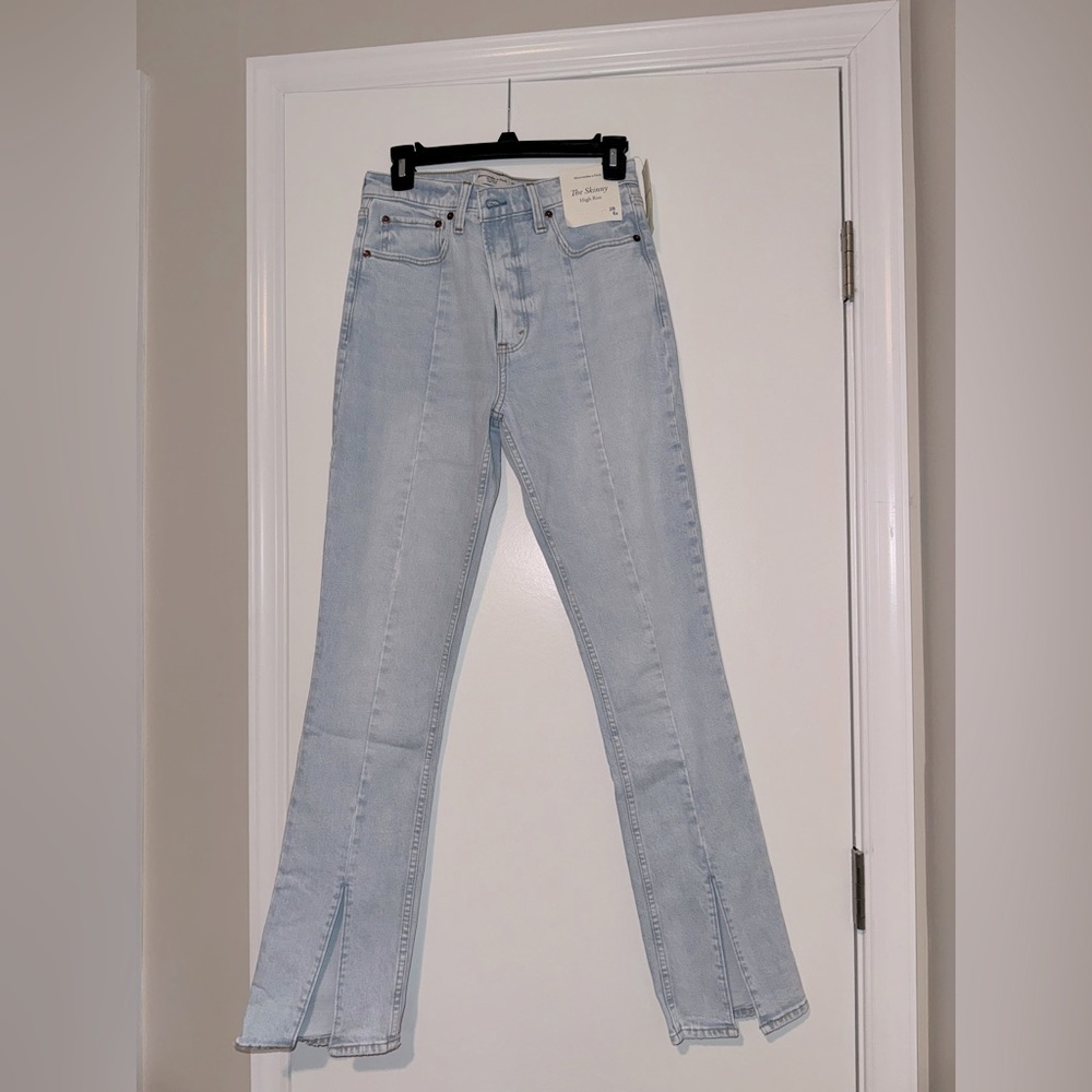 A&F “The Skinny High Rise” with slits at bottom. Size 28. Brand new with tags.